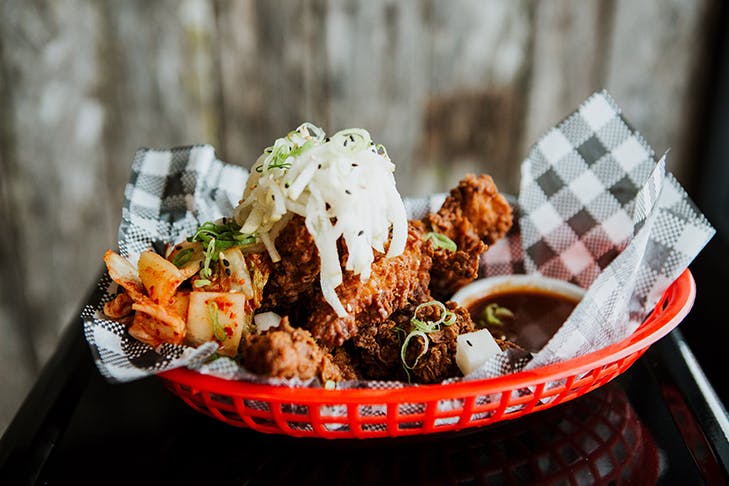 fried chicken wings in a red basket